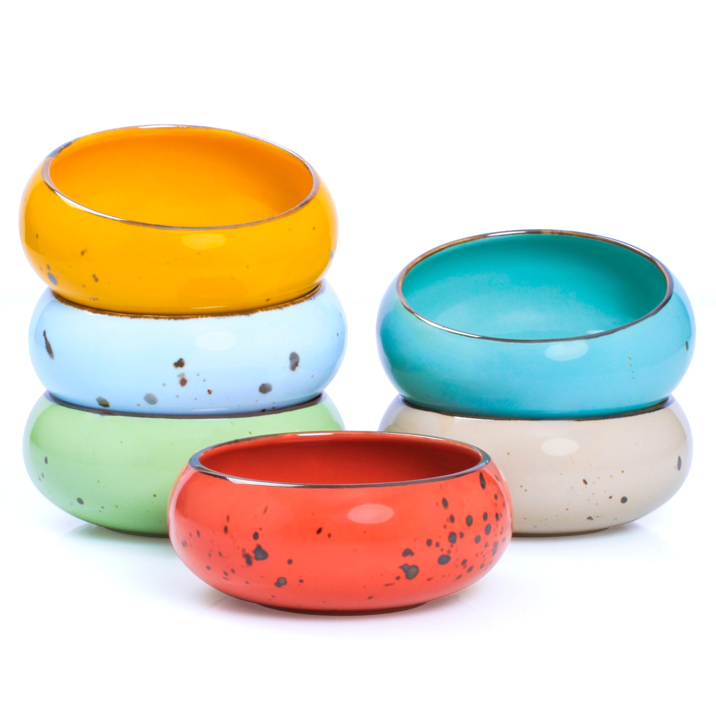 A vivid mix of small, hand‐crafted ceramic dessert bowls in assorted bright colors.