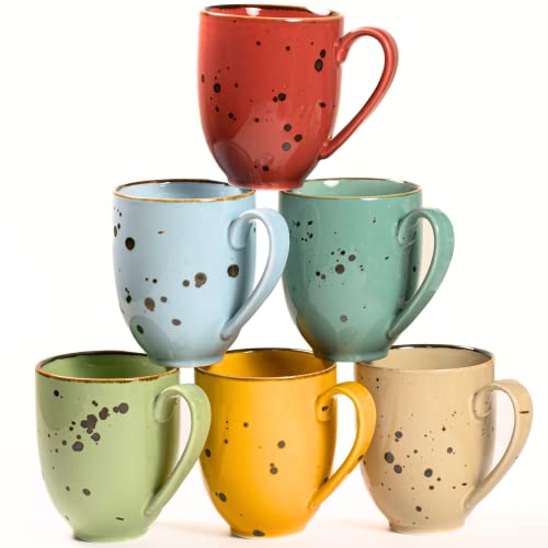 Six brightly colored ceramic coffee mugs arranged in a vivid assortment